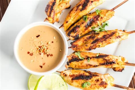 grilled-chicken-satay-skewers-with-peanut-sauce image
