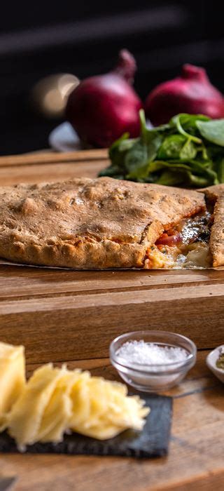 calzone-with-spinach-sun-dried-tomato-and-onion image