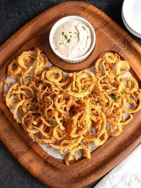 crispy-cajun-onion-strings-with-spicy-dipping-sauce image