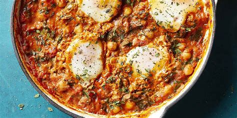 eggs-in-tomato-sauce-with-chickpeas-spinach-recipe-eatingwell image