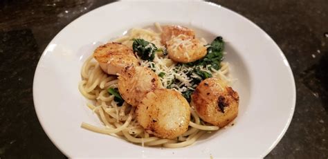 scallops-and-spinach-over-pasta-love-of-food-magazine image