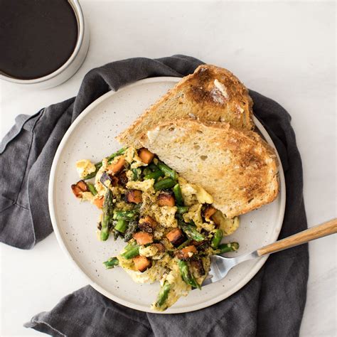 scrambled-eggs-with-vegetables-eatingwell image