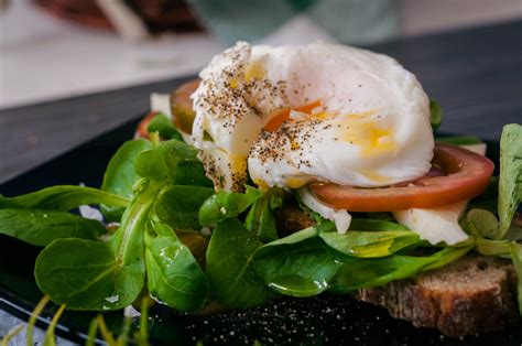 frise-salad-with-poached-egg-sauders-eggs image