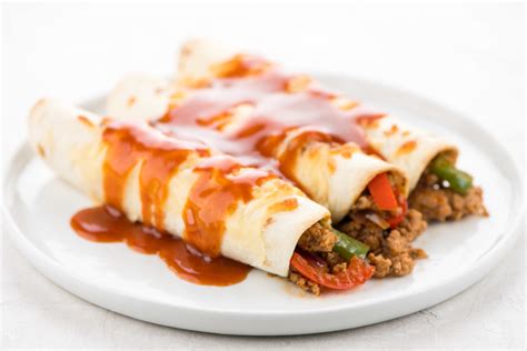 pork-enchiladas-with-oaxacan-cheese-recipe-home image