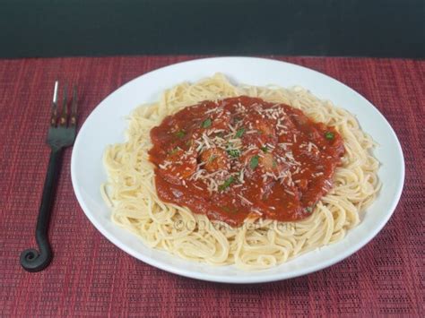slow-cooker-italian-sausage-pasta-sauce-with-spaghetti image