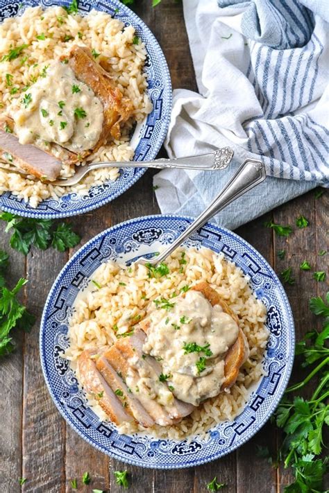 pork-chops-and-rice-with-creamy-mushroom-sauce image