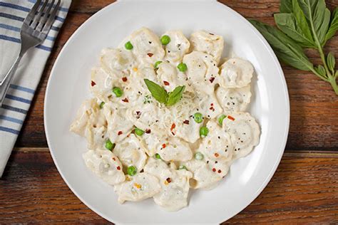 tortellini-with-peas-in-mushroom-cream-sauce image