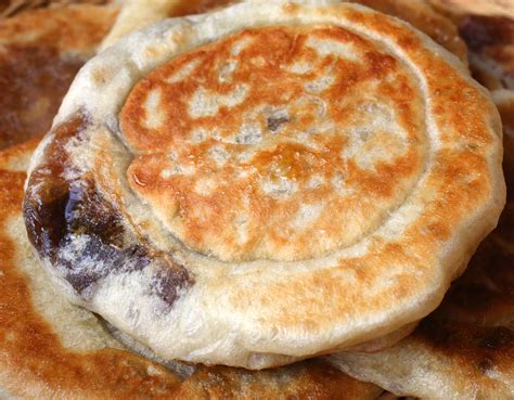 sweet-pancakes-with-brown-sugar-syrup-filling-cooking image