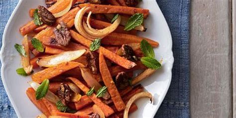 roasted-sweet-potatoes-and-carrots-recipe-country-living image