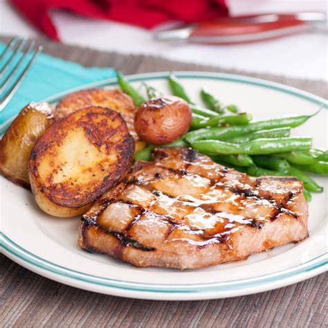 baked-pork-chops-with-green-beans-and-potatoes image