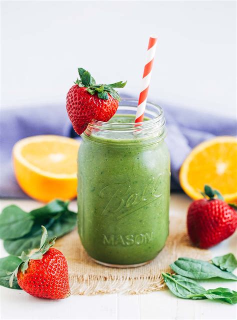 strawberry-mango-spinach-smoothie-making-thyme image