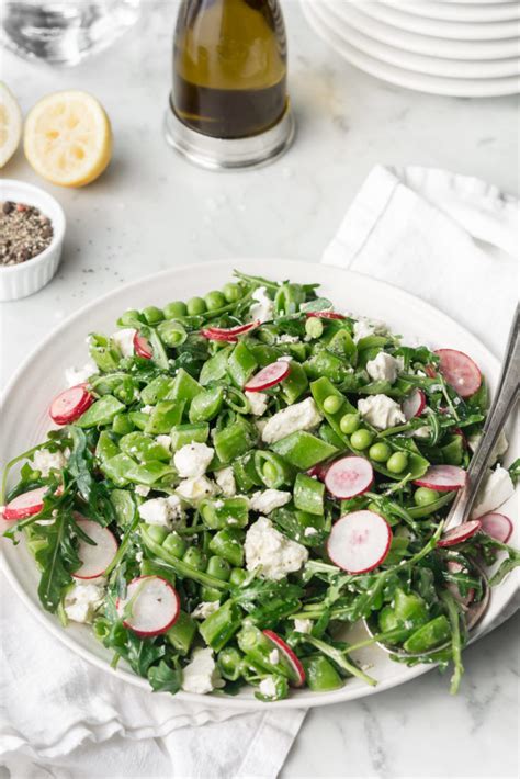 sugar-snap-pea-salad-with-radishes-feta-and-arugula image