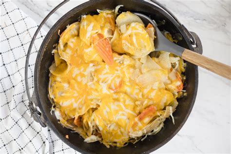 dutch-oven-potatoes-with-cheese-devour-dinner image