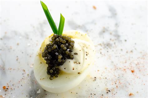 fancy-deviled-eggs-with-caviar-and-crme-frache image