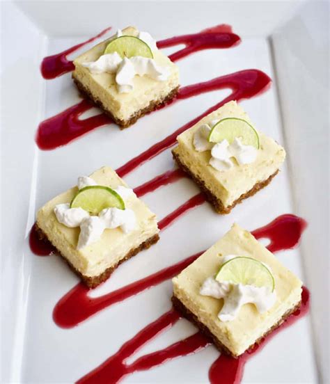 key-lime-cheesecake-bars-with-raspberry-sauce image