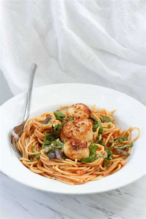 scallop-fra-diavolo-spicy-seafood-pasta-champagne image