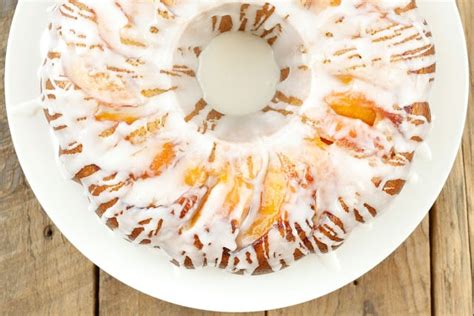 summer-pound-cake-with-peaches-and-almond-glaze image