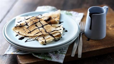 classic-pancakes-with-chocolate-sauce-recipe-bbc-food image