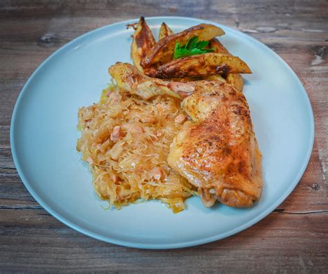 baked-chicken-legs-with-sauerkraut-and-potatoes image