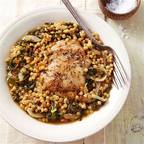 chicken-thighs-with-couscous-kale-eatingwell image