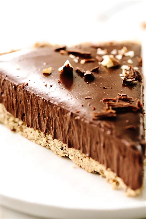 vegan-triple-chocolate-mousse-tart-with-hazelnut-crust image