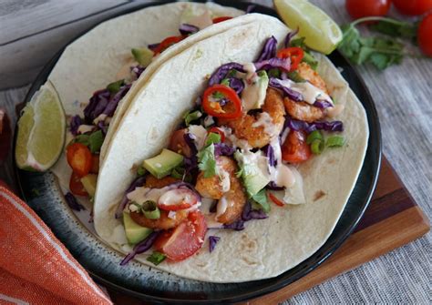 crispy-shrimp-tacos-with-creamy-sriracha-sauce-a-food image