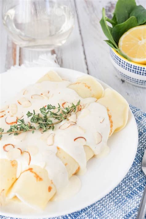 spinach-chicken-crepes-with-white-wine-cream-sauce image