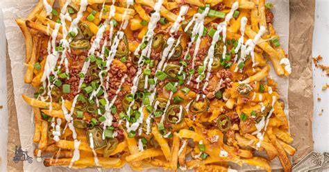 spicy-cheesy-loaded-potato-fries-with-jalapeo-peppers image