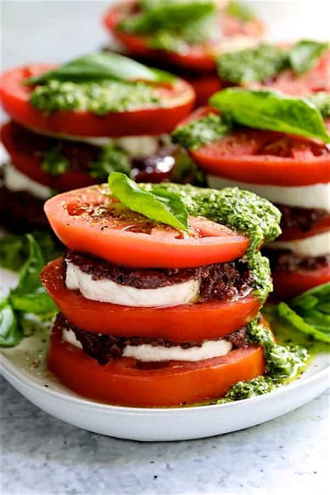 stacked-tomato-salad-recipe-with-basil-pesto-dressing image