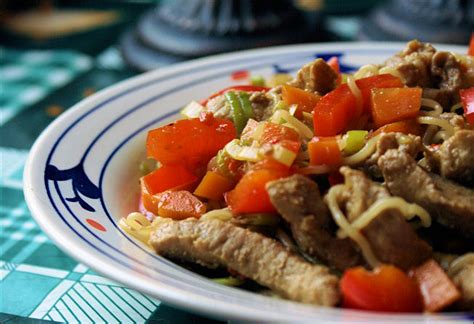 wok-with-marinated-pork-strips-tasty-kitchen image