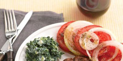 seared-steaks-with-tomato-salad-and-creamy-spinach image