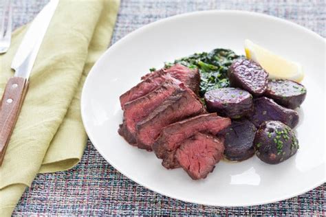 pan-seared-steaks-with-creamed-spinach-lemon image