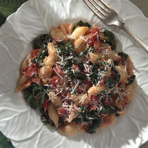 pasta-with-greens-tomato-sauce-recipe-eatingwell image