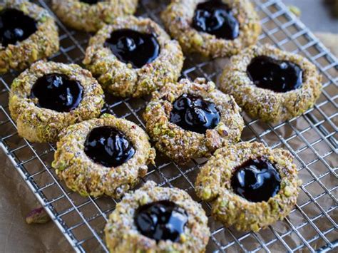 pistachio-thumbprint-cookies-with-black-currant-jam image