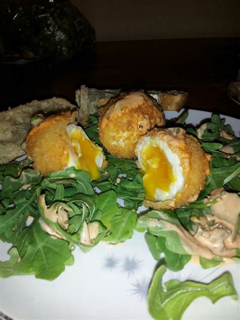 deep-fried-egg-on-arugula-with-sriracha-remoulade image