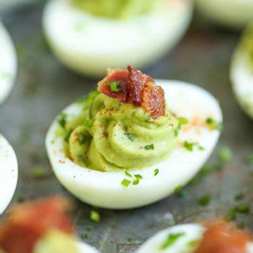 avocado-deviled-eggs-damn-delicious image