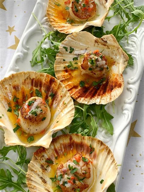 seared-scallops-infused-with-flavored-butter-and-herbs image