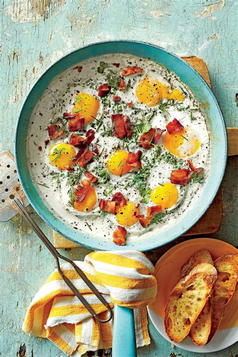 creamy-baked-eggs-with-herbs-and-bacon image