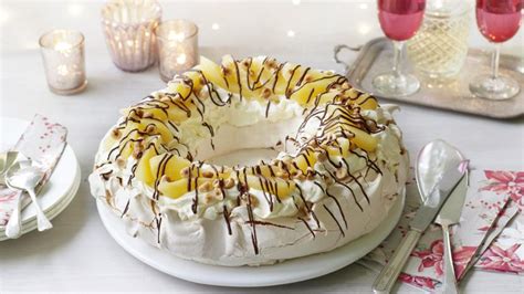 pear-hazelnut-and-chocolate-pavlova-recipe-bbc-food image