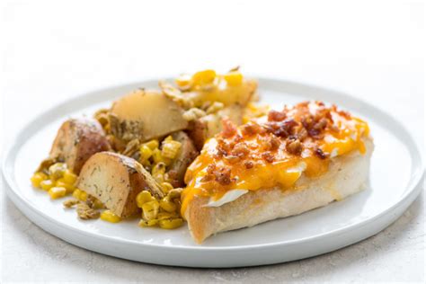 cheddar-bacon-crusted-chicken-with-ranch-potatoes image
