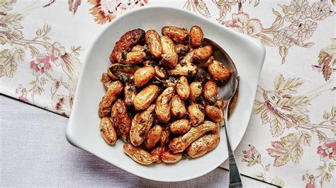crispy-potatoes-with-bay-and-scallions-recipe-bon-apptit image