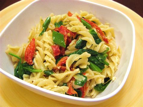 pasta-with-artichokes-sun-dried-tomatoes-and-spinach image
