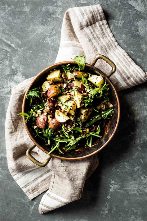 garlicky-roasted-potatoes-with-wilted-greens-bacon image