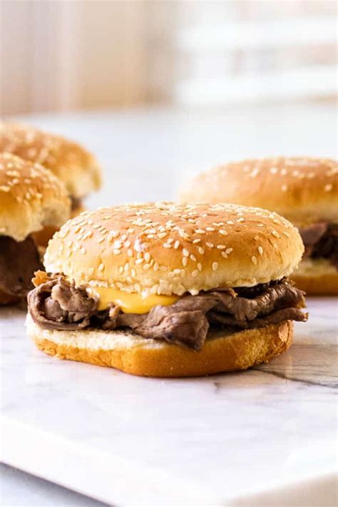 hot-roast-beef-sandwiches-with-cheddar-cheese-sauce image