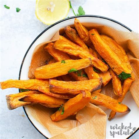 easy-crispy-baked-sweet-potato-fries-recipe-wicked image