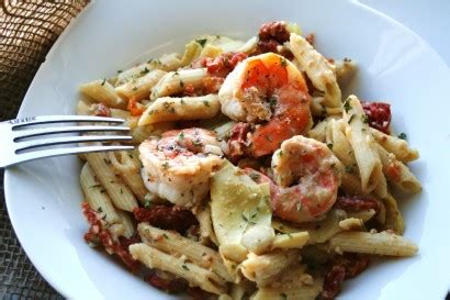 penne-with-shrimp-artichokes-and-sun-dried-tomatoes image