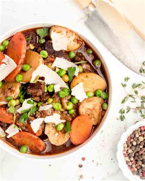 hearty-beef-stew-with-peas-carrots-and-potatoes image