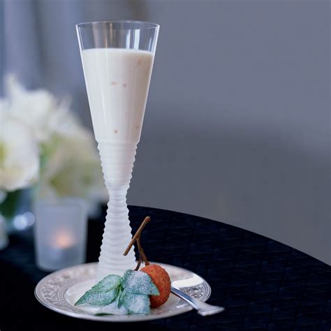 lychee-panna-cotta-with-sugared-basil-leaves image