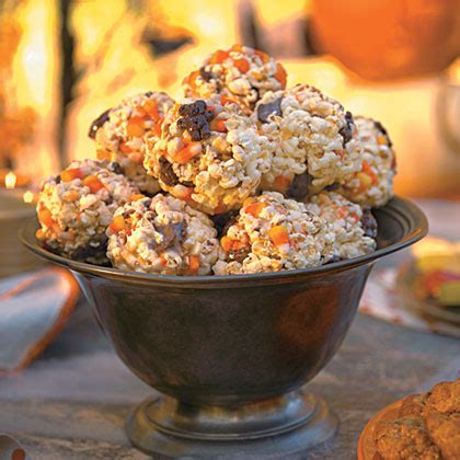 candy-corn-popcorn-balls-recipe-myrecipes image