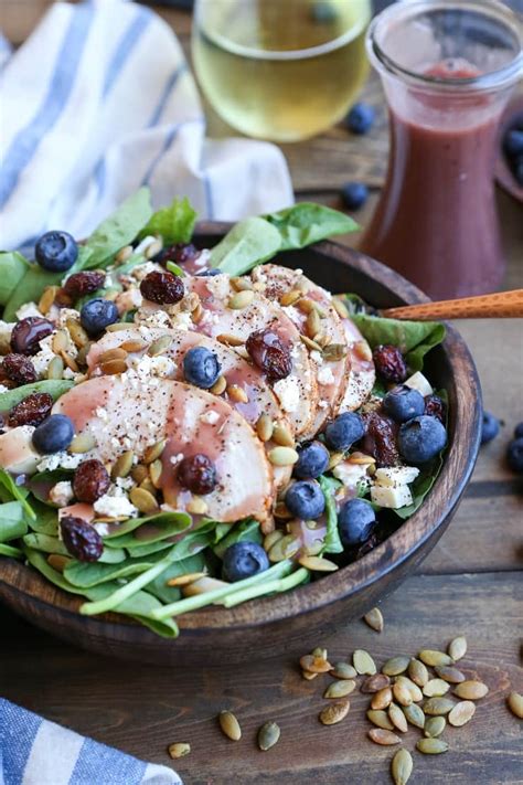 baked-chicken-spinach-salad-with-raspberry-vinaigrette image